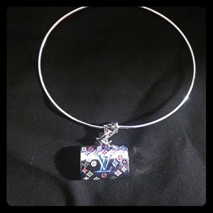 Louis Vuitton charm with bracelet.
